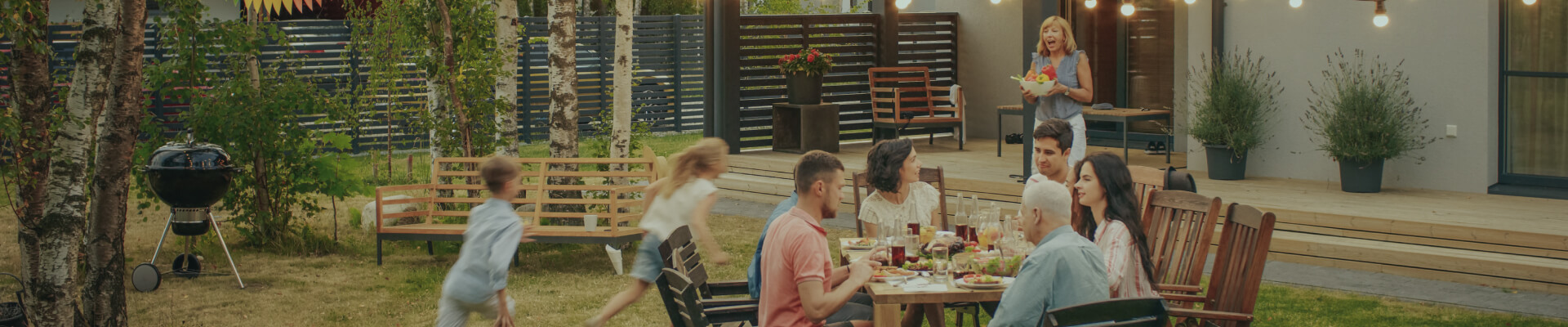 Multigenerational family eating outdoors.