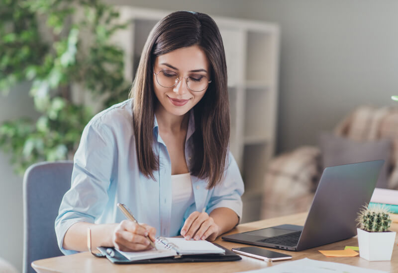 woman writing a list
