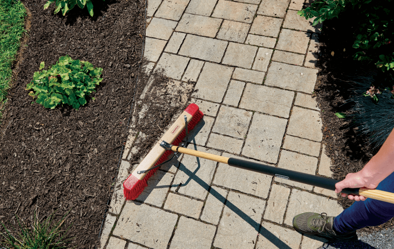 outdoor broom sweeping walkway